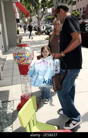 Tara Reid treated a male companion and his young daughter to a trip to Kitson Kids in Los Angeles, Calif. 5/19/07.  [[rac ral]] Stock Photo