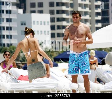 Italian soccer star Christian 'Bobo' Vieri and super hot girlfriend Melissa Satta enjoy the sun and surf on Miami Beach, Fla. 6/3/07.  [[tag]] Stock Photo