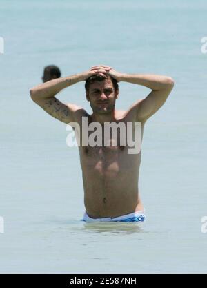 Italian soccer star Christian 'Bobo' Vieri and super hot girlfriend Melissa Satta enjoy the sun and surf on Miami Beach, Fla. 6/3/07.  [[tag]] Stock Photo