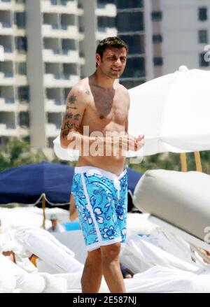 Italian soccer star Christian 'Bobo' Vieri and super hot girlfriend Melissa Satta enjoy the sun and surf on Miami Beach, Fla. 6/3/07.  [[tag]] Stock Photo