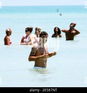 Italian soccer star Christian 'Bobo' Vieri and super hot girlfriend Melissa Satta enjoy the sun and surf on Miami Beach, Fla. 6/3/07.  [[tag]] Stock Photo