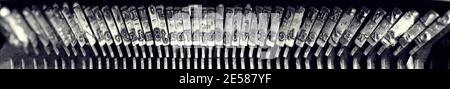 Black and white wide angle view of manual typewriter strikers. Stock Photo