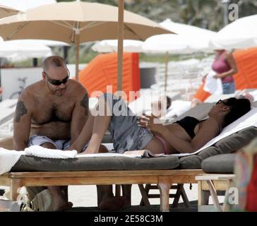 Exclusive!! Grammy Award-winning DJ/Producer and recording artist Roger Sanchez spends time on the beach with his partner. Miami, Fla. 7/7/07.    [[mab]] Stock Photo