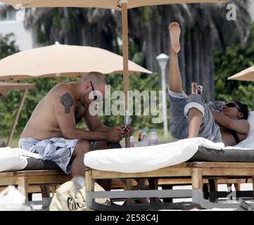 Exclusive!! Grammy Award-winning DJ/Producer and recording artist Roger Sanchez spends time on the beach with his partner. Miami, Fla. 7/7/07.    [[mab]] Stock Photo