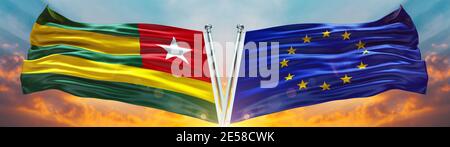 European Union Flag and Togo flag waving with texture sky Cloud and sunset Double flag Stock Photo