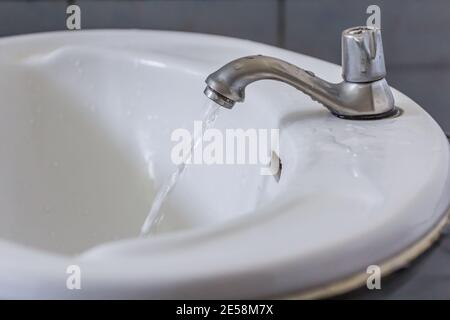 water tap in the restroom. Flowing water out Stock Photo