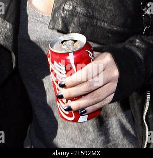 Lindsay Lohan was spotted with Coke today! Coca Cola that is! The actress was snapped leaving the Italian restaurant La Scala holding a can of full-sugar Coca Cola. Beverly Hills, CA. 12/17/07.   [[mll]] Stock Photo