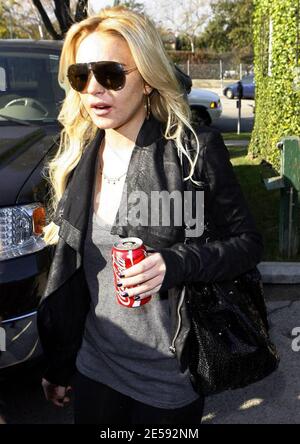 Lindsay Lohan was spotted with Coke today! Coca Cola that is! The actress was snapped leaving the Italian restaurant La Scala holding a can of full-sugar Coca Cola. Beverly Hills, CA. 12/17/07.   [[mll]] Stock Photo