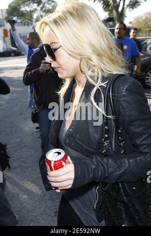 Lindsay Lohan was spotted with Coke today! Coca Cola that is! The actress was snapped leaving the Italian restaurant La Scala holding a can of full-sugar Coca Cola. Beverly Hills, CA. 12/17/07.   [[mll]] Stock Photo