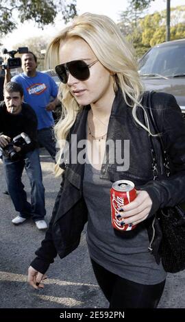 Lindsay Lohan was spotted with Coke today! Coca Cola that is! The actress was snapped leaving the Italian restaurant La Scala holding a can of full-sugar Coca Cola. Beverly Hills, CA. 12/17/07.   [[mll]] Stock Photo