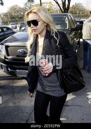 Lindsay Lohan was spotted with Coke today! Coca Cola that is! The actress was snapped leaving the Italian restaurant La Scala holding a can of full-sugar Coca Cola. Beverly Hills, CA. 12/17/07.   [[mll]] Stock Photo