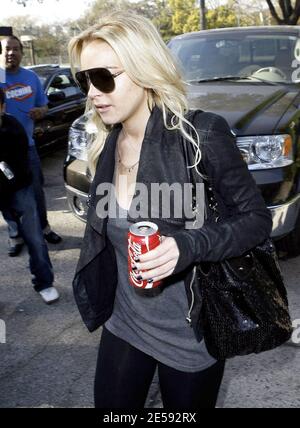 Lindsay Lohan was spotted with Coke today! Coca Cola that is! The actress was snapped leaving the Italian restaurant La Scala holding a can of full-sugar Coca Cola. Beverly Hills, CA. 12/17/07.   [[mll]] Stock Photo