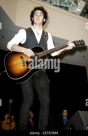 Exclusive!! American pop band The Jonas Brothers perform a free concert at the Rockaway Townsquare Mall. Britney Spears' former bodyguard, Big Rob is on hand to make sure Kevin, Joe and Nick Jonas are safe and sound at the show. Rockaway, NJ. 12/29/07.   [[faa]] Stock Photo