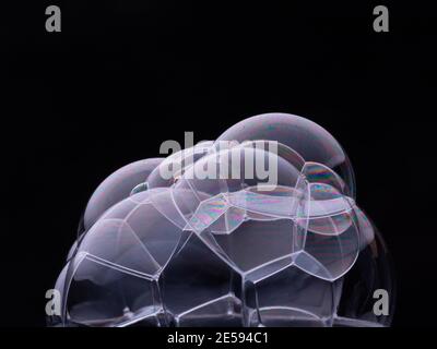 Soap bubbles isolated on black background. Macro shot Stock Photo