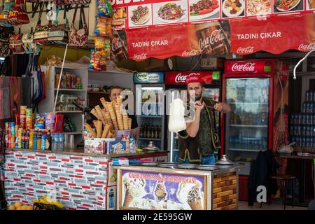 Istanbul / Turkey - 2 May 2019 : Young man dressed up in Cospay, Turkish-style, is showing ice cream in a food shop in a tourist attraction. Stock Photo
