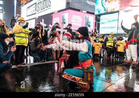 New York, NY - January 26, 2021: Immigrants perform pre Hispanic dance and blessings during rally and march for immigrants rights on Times Square Stock Photo