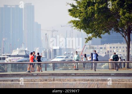 People walking on Kwun Tong Promenade, Hong Kong Stock Photo