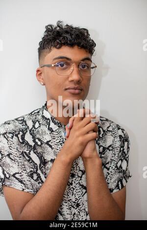 Close up portrait of young man with blue nail polish Stock Photo
