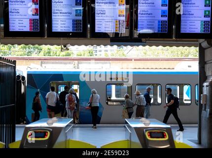 Commuters on a Flinders Street railway platform in Melbourne, Victoria, Australia. Stock Photo