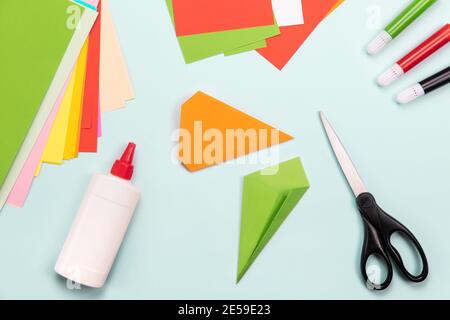 How to make Origami paper bookmark form of carrot for Easter greetings. Childrens art project. DIY concept. Step by step photo instruction. Step 4 Stock Photo