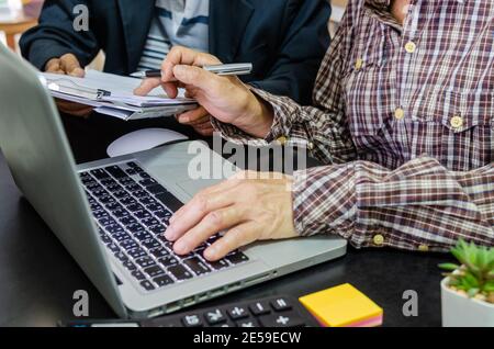 Meeting to review business documents and information on marketing and financial statements, reports and business planning. Stock Photo