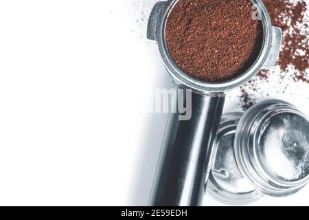 Espresso holder and replaceable coffee filters. The horn from the coffee machine on a white  Stock Photo