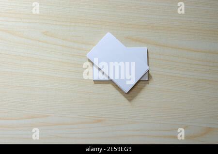 Blank Paper Mockup for Business Cards on wood. Stock Photo