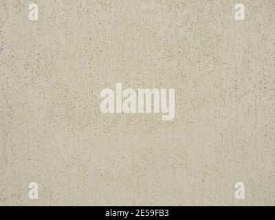 Beige wall with decorative plaster with patterned scratches. Texture Stock Photo