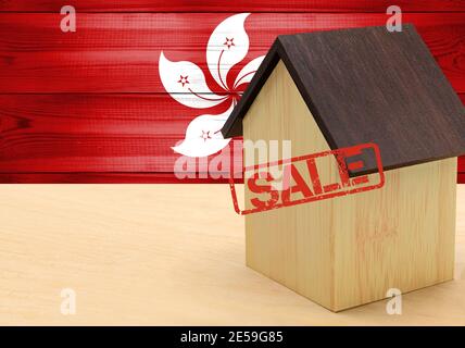 The concept sale of apartments, of real estate mortgages, citizenship and accommodation, as well as investment in a future home. Hong Kong flag on woo Stock Photo