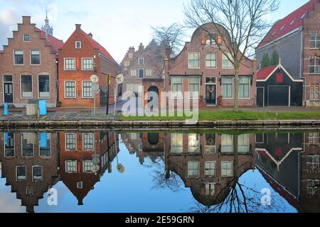 Reflections of historic and colorful houses along Nieuwe Haven street, Edam, North Holland, Netherlands Stock Photo