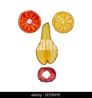 Funny surprised face made of dried fruits on white background Stock Photo
