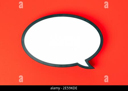 Blank speech bubble isolated on red background. Nobody Stock Photo