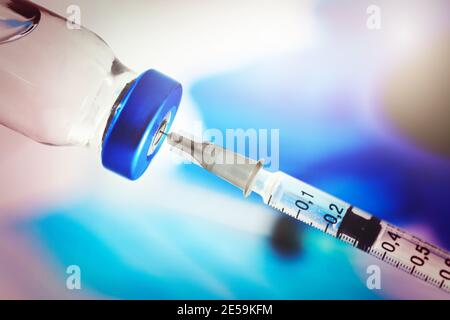medical syringe with vaccine vial. vaccination concept. closeup Stock Photo