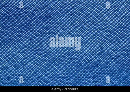 Seamless plastic texture background. Close-up of a detail from a blue surface of a cosmetic bag. Beautiful backdrop. Macro. Stock Photo