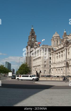 Stretch Limousine in front of the Three Graces Buildings on Liverpool Waterfront Stock Photo