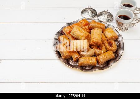 Cup of hot tea and a plate of turkish desserts Stock Photo