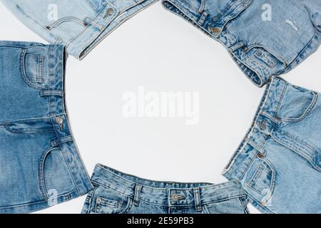 empty frame made from various blue jeans on white background, top view Stock Photo