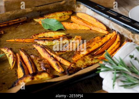 Sweet potato fries on a baking tray Stock Photo