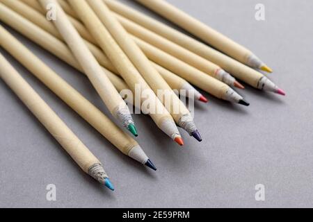 Eco-friendly pencils. Colored pencils for drawing. Grey background. Stock Photo