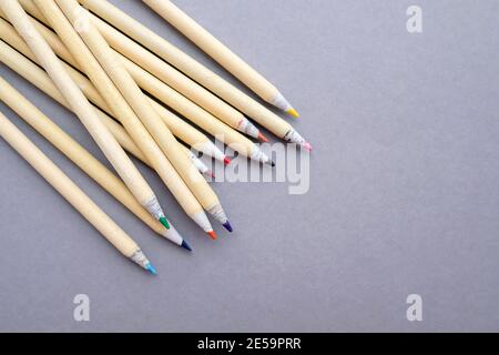Eco colored pencils for drawing on gray background. Stock Photo