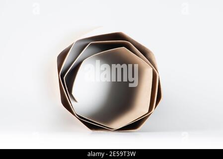 Beige paper roll on white background. Macro shot. Abstract background. Copy space. Stock Photo