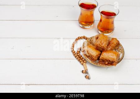 Cup of hot tea and a plate of turkish desserts Stock Photo