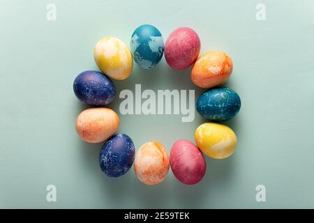 Easter eggs in minimal style on blue background. Easter concept. Flat layout Stock Photo