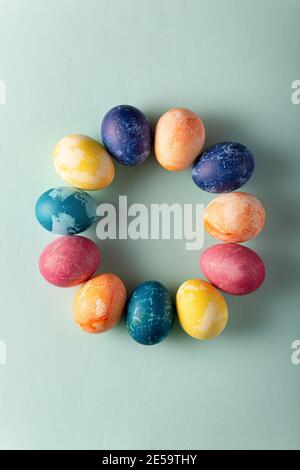 Easter eggs in minimal style on blue background. Easter concept. Flat layout Stock Photo