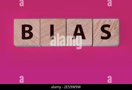 the word bias on wooden blocks blue background Stock Photo