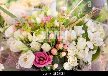 Closeup image of beautiful flowers wall background with amazing white roses. Bouquet of white and pink flowers. Stock Photo