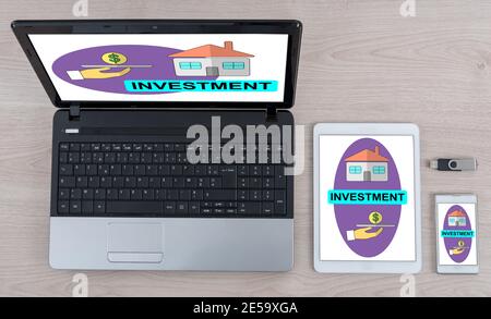 Investment concept shown on different information technology devices Stock Photo