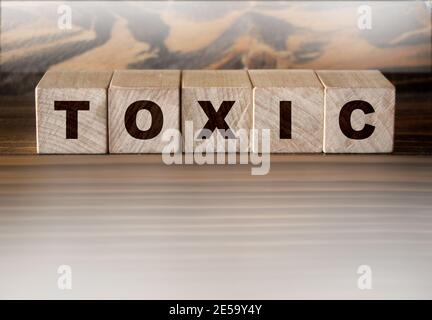 Toxic Word written on wooden cubes. Addiction concept Stock Photo