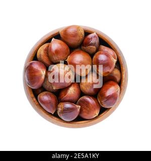 Pile of fresh chestnuts in a bamboo bowl isolated over white background with clipping path. Top view Stock Photo