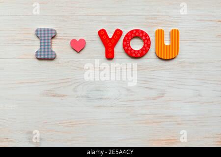 Word I love you of wooden letters on wood vintage background. Flat lay, top view, copy space. Valentines day concept Stock Photo